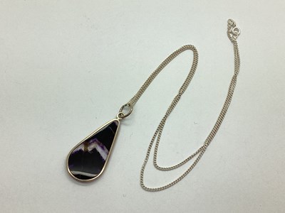 Lot 141 - A Blue Joh Pendant, elongated teardrop, on a...