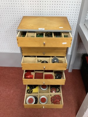 Lot 325 - A set of nine wooden drawers housing a a...