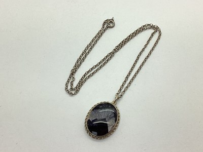Lot 144 - A Blue John Oval Panel Pendant, collet set...