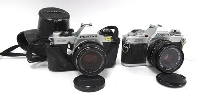 Lot 1379 - Canon AV-1 35mm Film SRL Camera 1559408 with...