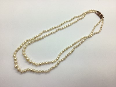 Lot 211 - A Two Row Graduated Pearl Bead Necklace,...