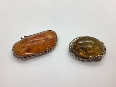 Lot 103 - An Amber Brooch, 6.2cm wide; together with...