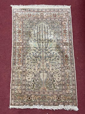 Lot 1668 - Middle Eastern Silk Tassled Rug, featuring...