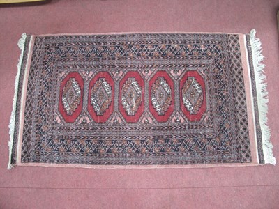 Lot 1661 - Middle Eastern Wool Tassled Rug, with five...