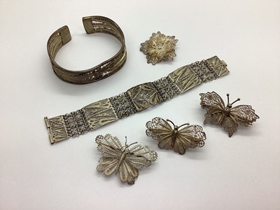 Lot 195 - A Square Filigree Panel Bracelet, between...