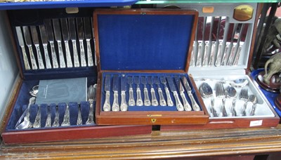 Lot 1367 - Three wooden cased silver-plated canteens of...
