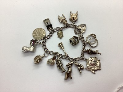 Lot 107 - A Curb Link Charm Bracelet, to heart shape...