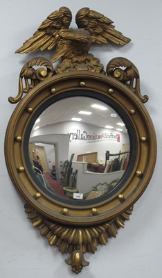 Lot 1392 - XIX Century Regency Gilt Convex Mirror, top...
