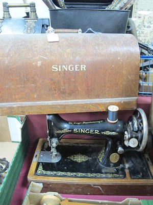 Lot 1231 - A Singer Sewing Machine, (cased).