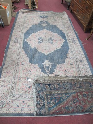 Lot 1233 - Two Middle Eastern Floral Rugs, in distressed...