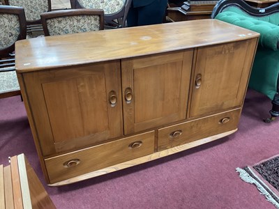 Lot 1666 - Ercol Sideboard, with three cupboard doors,...