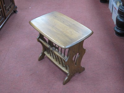 Lot 1620 - Ercol Style Magazine Rack on shaped supports,...