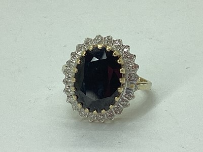Lot 59 - A Large Sapphire and Diamond Cluster Ring,...