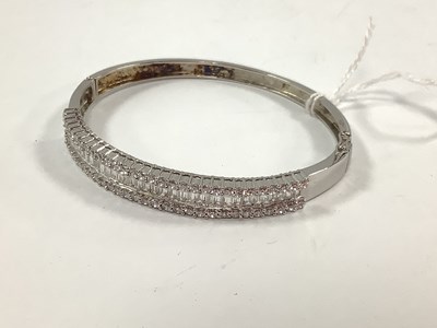 Lot 209 - A Modern CZ Inset Hinged Bangle, claw set to...