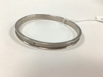 Lot 206 - A Modern Diamond Set Hallmarked Silver Bangle,...
