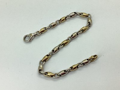 Lot 146 - A Bi-Colour Bullet Rolo Link Style Bracelet,...