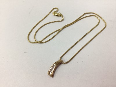 Lot 166 - A Modern Channel Set Diamond Pendant, stamped "...