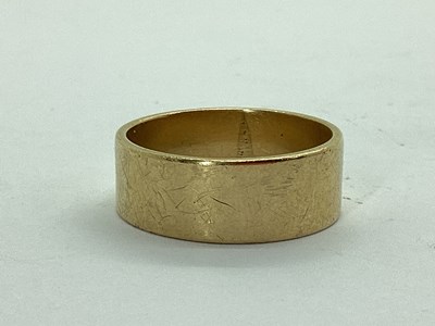 Lot 41 - A Wide Plain Wedding Band, unmarked (finger...