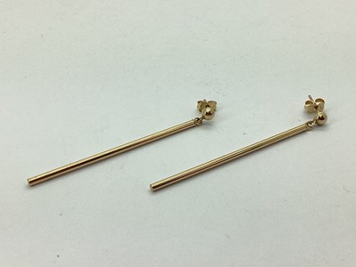 Lot 135 - A Pair of Plain Bar Drop Earrings, to post and...