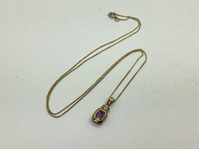 Lot 85 - A Rubover Set Emerald Cut Pendant, with...