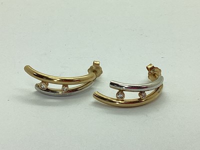 Lot 127 - A Pair of Modern Bi-Colour Curved Bar Earrings,...