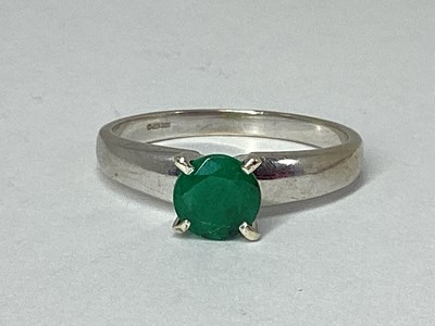 Lot 82 - A 9ct White Gold Single Stone Dress Ring, four...