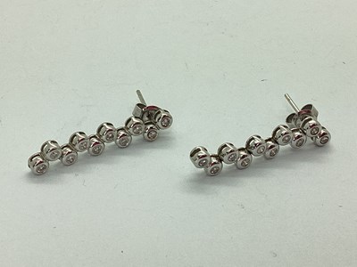 Lot 133 - A Pair of Multi Diamond Drop Earrings, rubover...