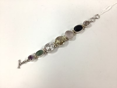 Lot 187 - A Modern Chunky Multi Set Bracelet, graduated...