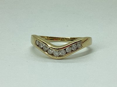 Lot 60 - A 9ct Gold Channel Set Diamond Band, of...