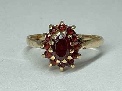 Lot 61 - A 9ct Gold Oval Cluster Ring, claw set...