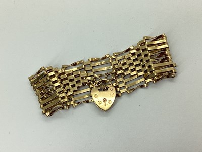 Lot 129 - A Wide 9ct Gold Gate Link Bracelet, to heart...