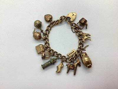 Lot 117 - A 9ct Gold Curb Link Charm Bracelet, to 9ct...