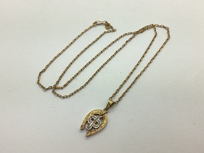 Lot 114 - A Modern Horseshoe Pendant, with inset...