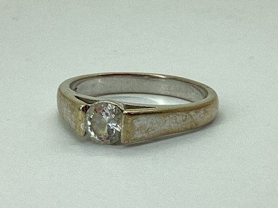 Lot 72 - A Single Stone CZ Set Ring, between plain...