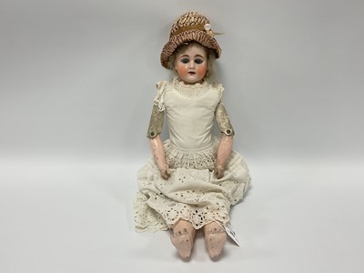 Lot 882 - A Early XX Century Bisque Headed Leather...
