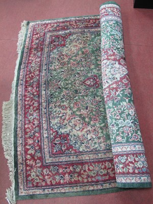 Lot 1176 - Middle Eastern Wool Tasselled Rug, with maroon...
