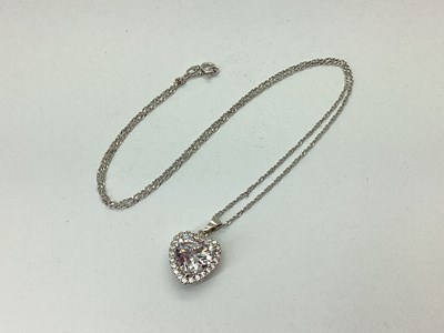 Lot 112 - A Modern 925 CZ Heart Pendant, claw set within...