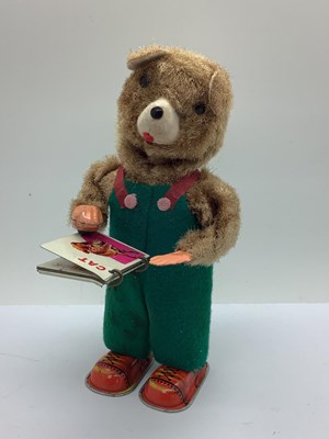 Lot 658 - A 1960s Japanese Clockwork Bear Reading a Book,...