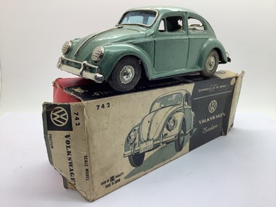 Lot 671 - A 1960s Japanese Tinplate Volkswagen Beetle...