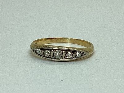 Lot 66 - A Graduated Five Stone Boat Shape Ring,...