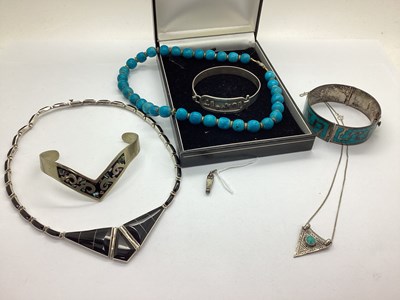 Lot 111 - An Art Deco Style Egyptian Revival Enamelled...