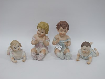 Lot 1257 - Four Large Porcelain Piano Babies, the tallest...
