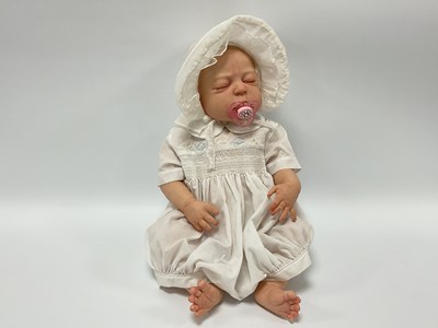 Lot 879 - A Lifelike Silicone Baby Girl Doll, marked S.M....