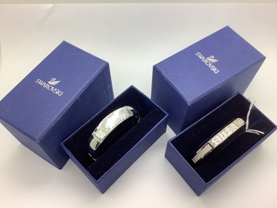 Lot 147 - Swarovski; A Modern Chunky Hinged Bangle,...