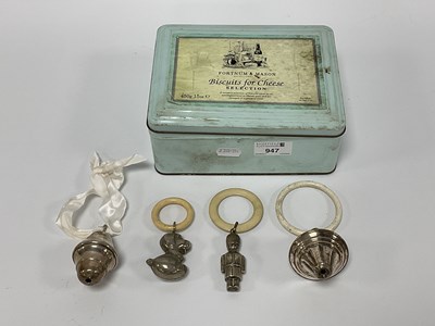 Lot 947 - Four Silver Plated Baby Rings, including a dog...