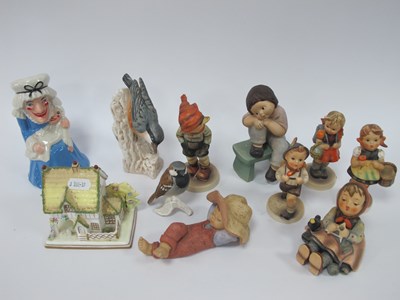 Lot 1223 - Ceramic figurines, including assorted German...