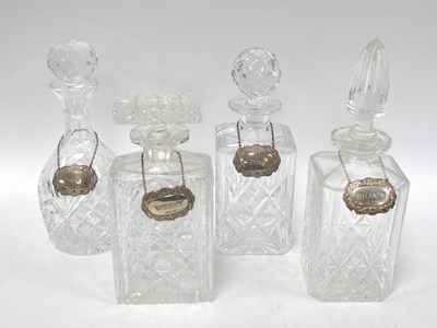 Lot 1268 - A Set of Four Crystal Decanters, with four...