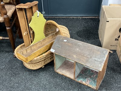 Lot 1580 - Wicker Dolls Crib, 58cm long, wooden displays.