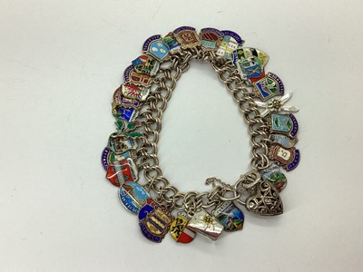 Lot 107 - A Double Curb Link Charm Bracelet, to openwork...
