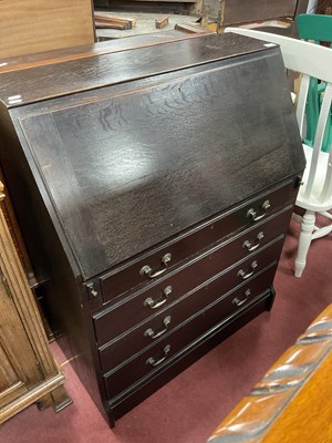 Lot 1597 - Early XX Century Oak Bureau, with a fall front,...